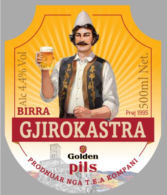 Paraqitja e markës BIRRA GJIROKASTRA PILS GOLDEN PRODHUAR NGA T.E.A KOMPANI